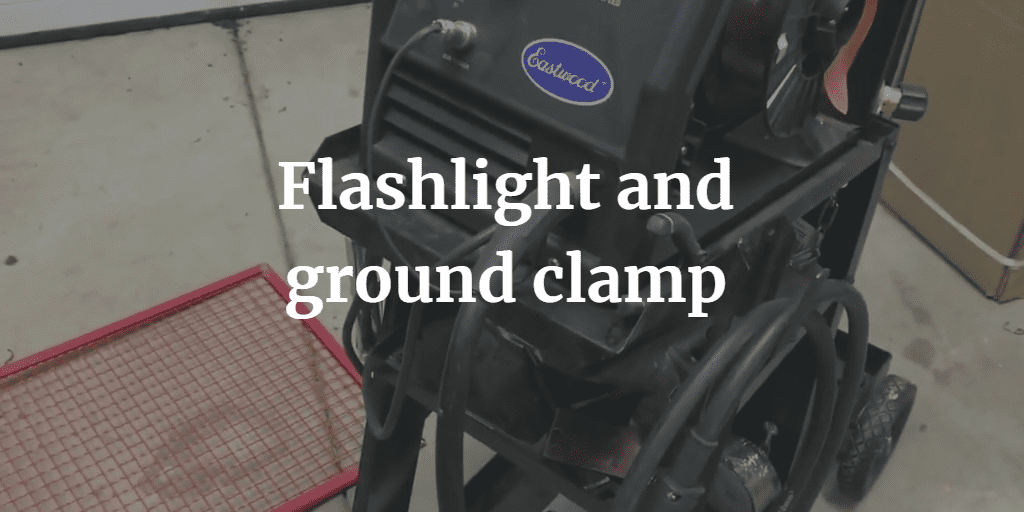Flashlight and ground clamp